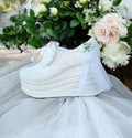 Elegant white bridal sneakers with lace, satin, and floral decorations, featuring a 9-10 cm height with a 4 cm platform, perfect for weddings, dances, and special bridal ceremonies. Beirut Lebanon
