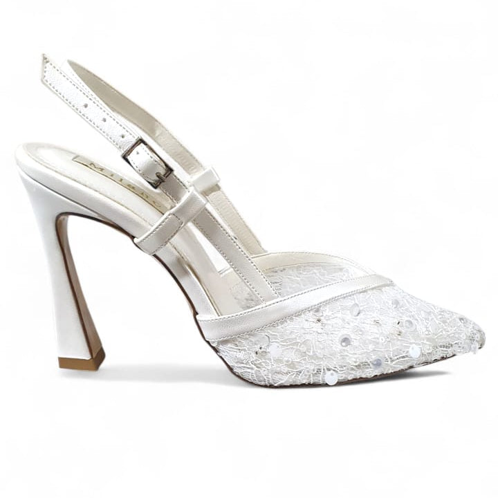 White high-heeled shoes with glittery sole on a white background